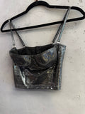 BERLIN VINTAGE CORNER roccobarocco metallic silver corset crop top with adjustable spaghetti straps on a hanger.