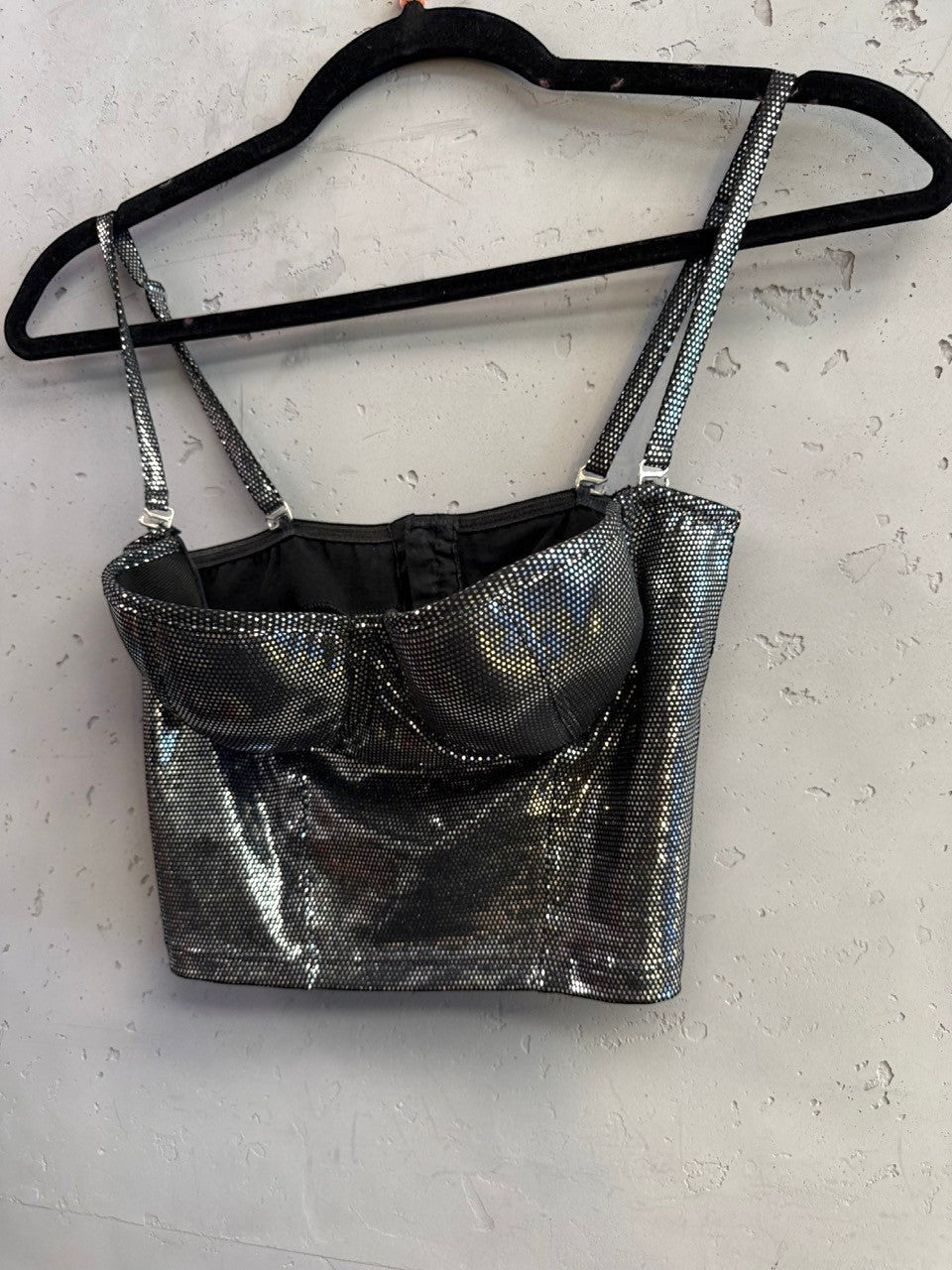BERLIN VINTAGE CORNER roccobarocco metallic silver corset crop top with adjustable spaghetti straps on a hanger.