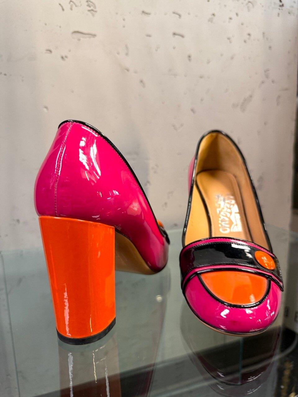 Ferragamo pumps, black patent vamp strap with orange button