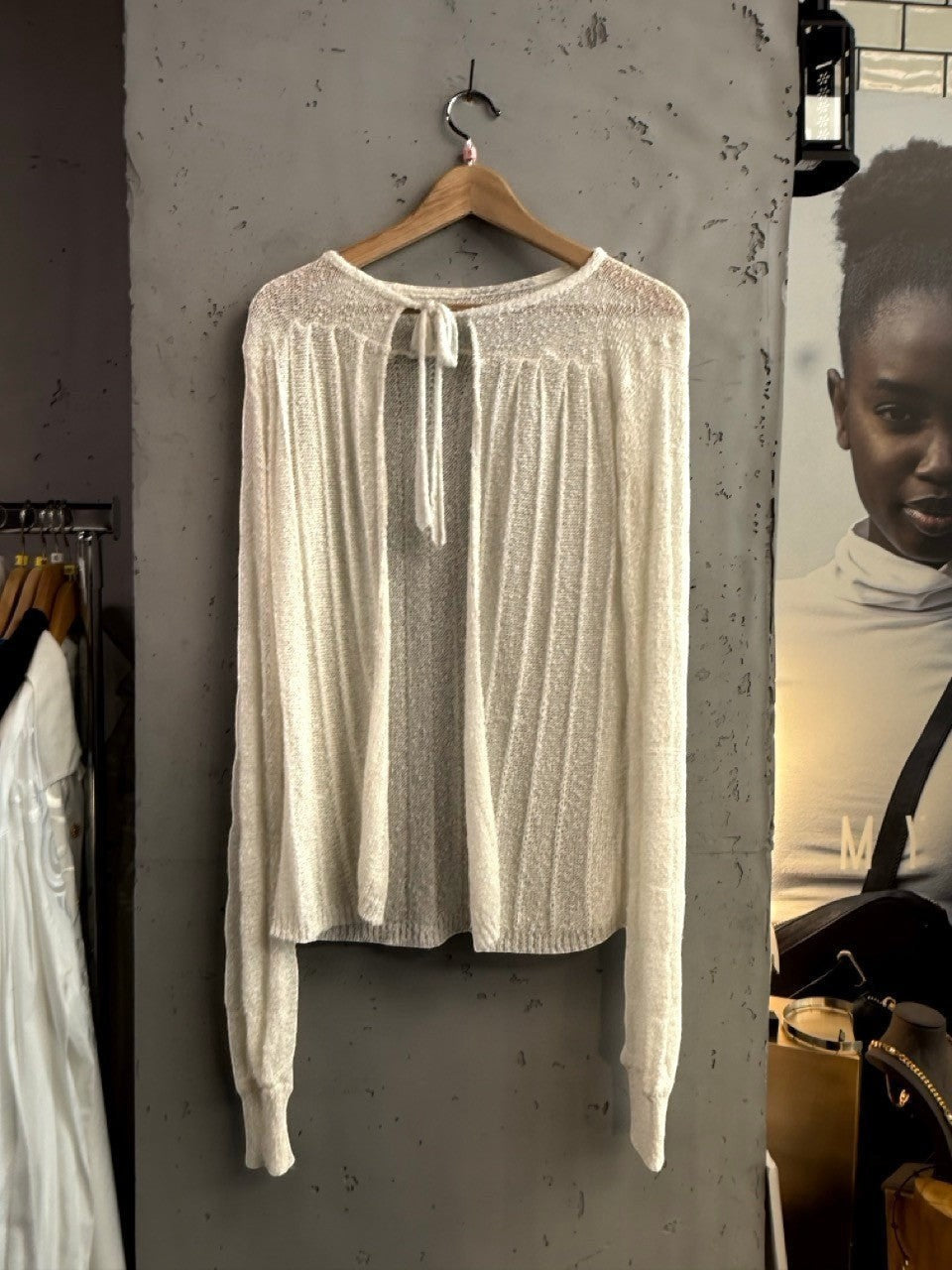 BERLIN VINTAGE CORNER off-white sheer knit long sleeve cardigan with tie detail and vertical ribbing.