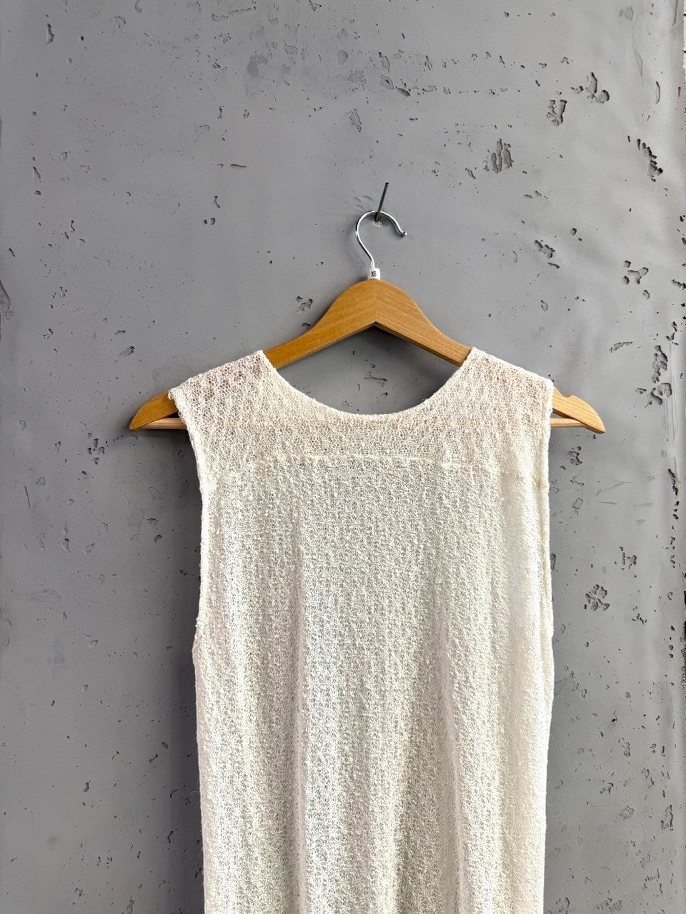 BERLIN VINTAGE CORNER off-white sheer knit sleeveless top with crew neckline and textured fabric.