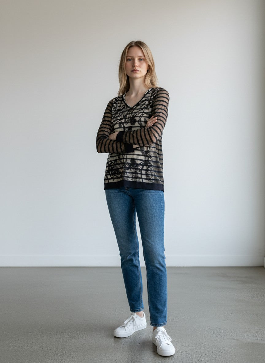 BERLIN VINTAGE CORNER sheer V-neck top with abstract print over stripes and black trim.