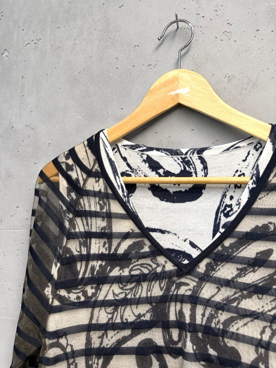 BERLIN VINTAGE CORNER sheer V-neck top with abstract print and black trim. Lightweight, long-sleeved.