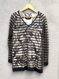 BERLIN VINTAGE CORNER sheer long-sleeved V-neck top with abstract print and horizontal stripes, black trim.