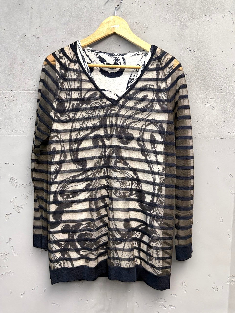 BERLIN VINTAGE CORNER sheer long-sleeved V-neck top with abstract print and horizontal stripes, black trim.