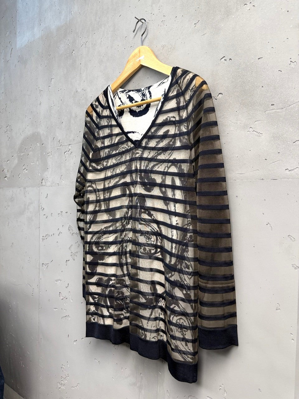 BERLIN VINTAGE CORNER sheer long-sleeved V-neck top with abstract print and black trim.