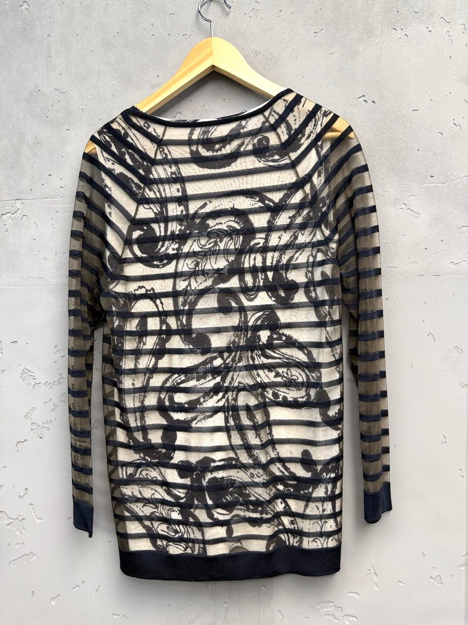 BERLIN VINTAGE CORNER sheer long-sleeved V-neck top with black abstract print and horizontal stripes, black trim.