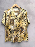 BERLIN VINTAGE CORNER silk animal print blouse with tigers and leopards, gold-tone shoulder buttons.