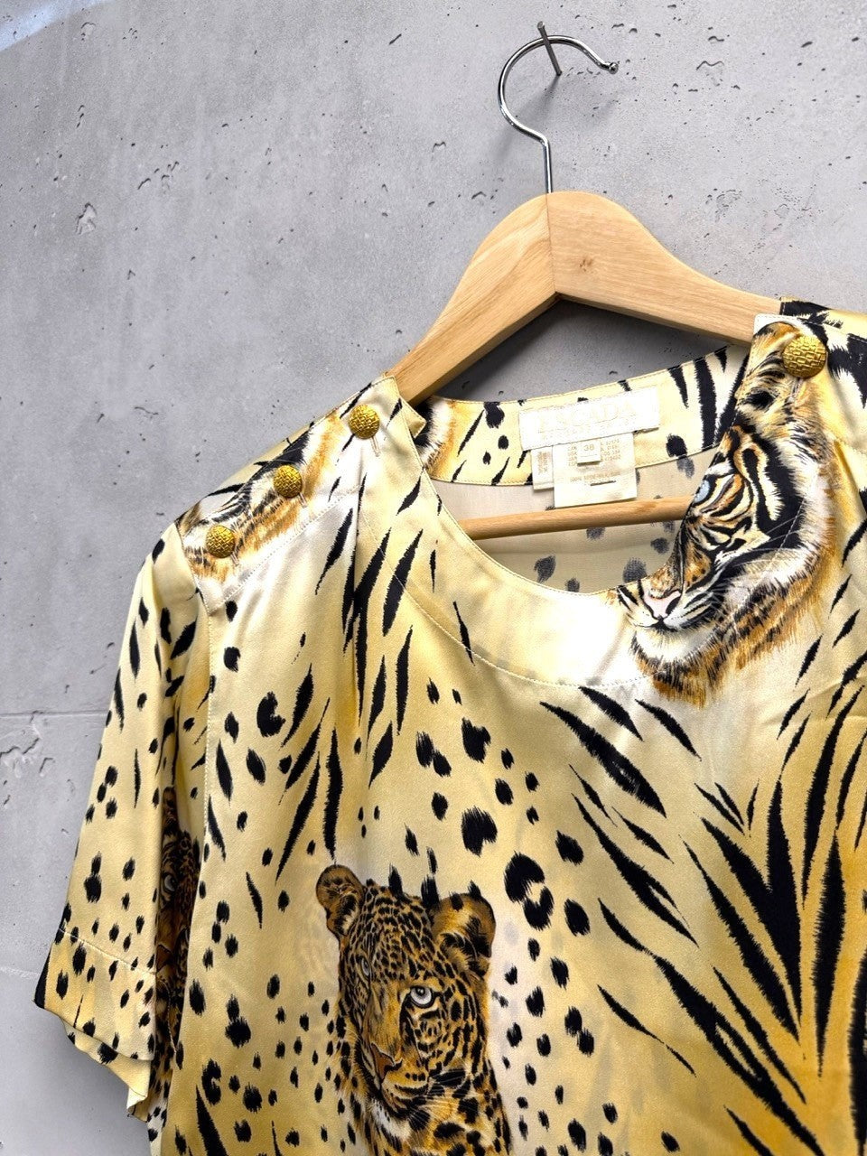 BERLIN VINTAGE CORNER silk blouse with bold tiger and leopard print, gold shoulder buttons.