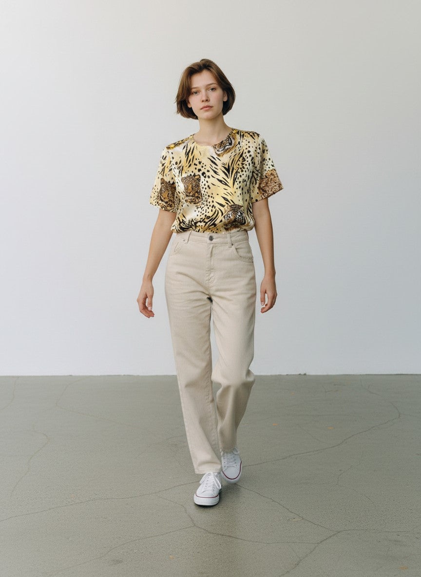 BERLIN VINTAGE CORNER silk animal print blouse with tigers, leopards, and lions. Features gold-tone shoulder buttons.