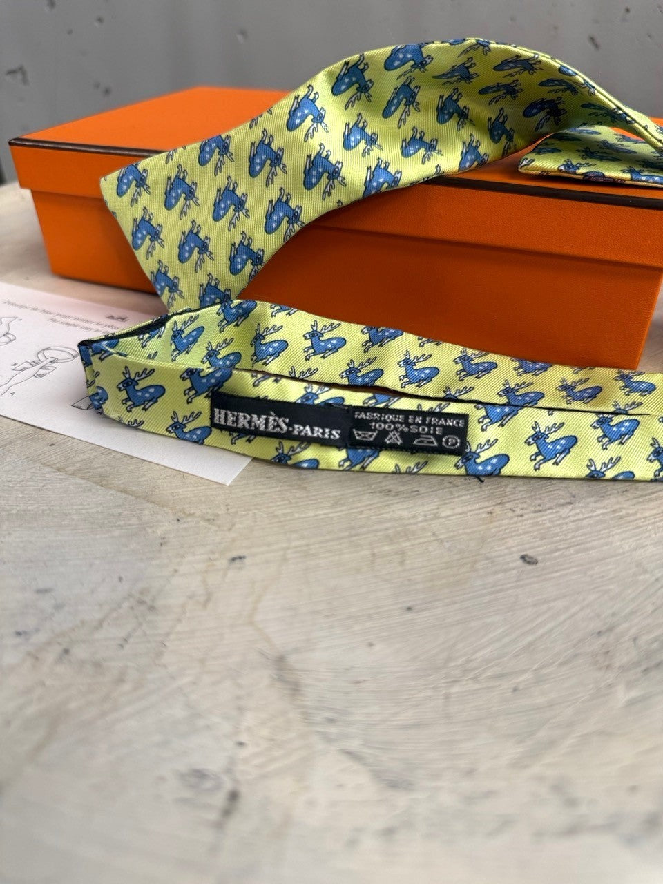 BERLIN VINTAGE CORNER lime green 100% silk bow tie with blue leaping deer pattern. Pre-tied for effortless elegance.