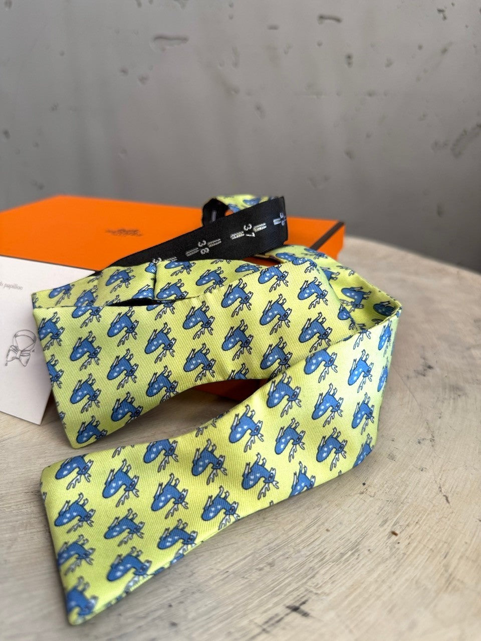 BERLIN VINTAGE CORNER lime green silk bow tie with blue deer pattern. Pre-tied with adjustable strap.