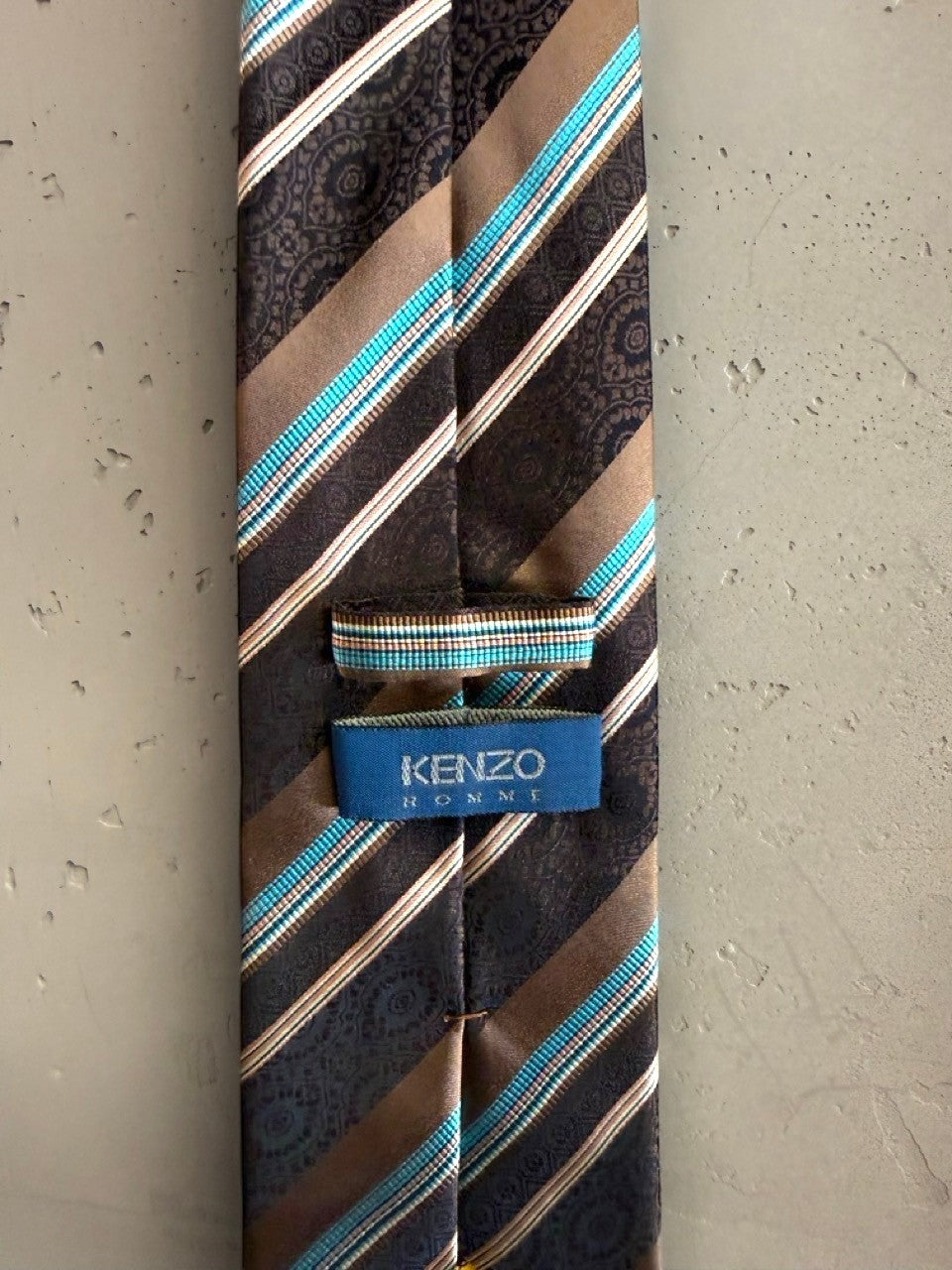 BERLIN VINTAGE CORNER brown, white, and turquoise silk tie with diagonal stripes and paisley pattern.