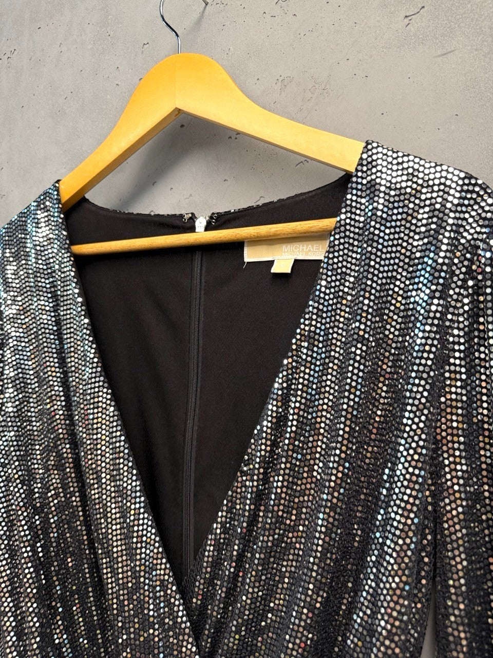 BERLIN VINTAGE CORNER silver sequin wrap dress with V-neckline, long sleeves, and tie waist.