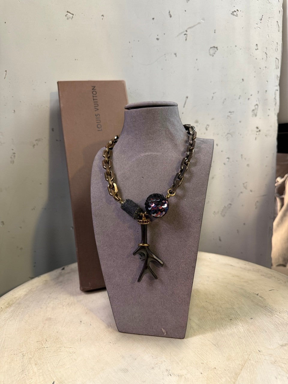 BERLIN VINTAGE CORNER statement necklace with chunky antiqued metal chain, dark bead, sequined orb, and branch pendant.