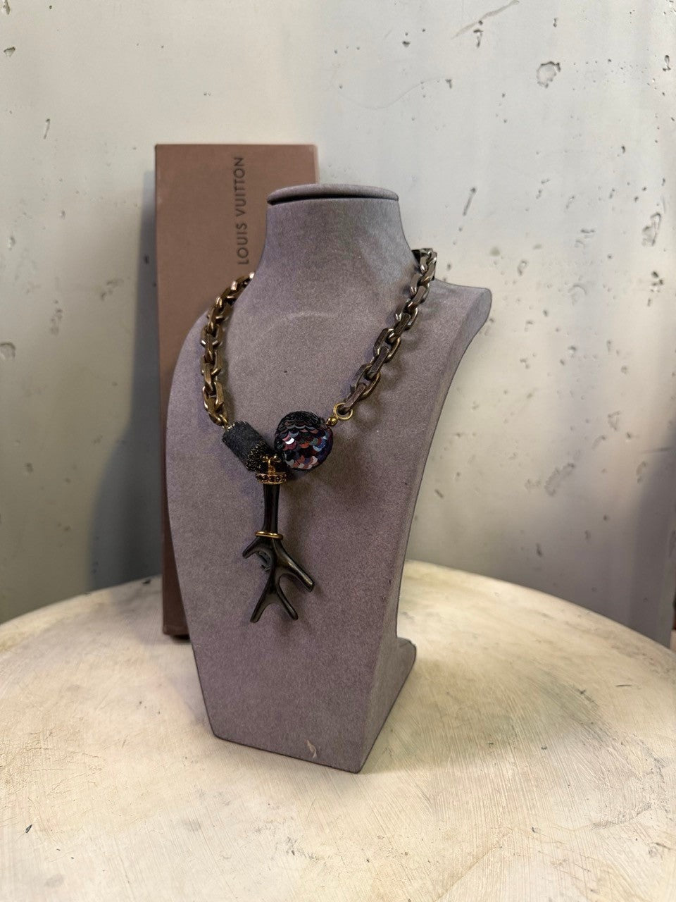BERLIN VINTAGE CORNER statement pendant necklace with chunky antiqued metal chain, dark bead, sequined orb, and branch pendant.