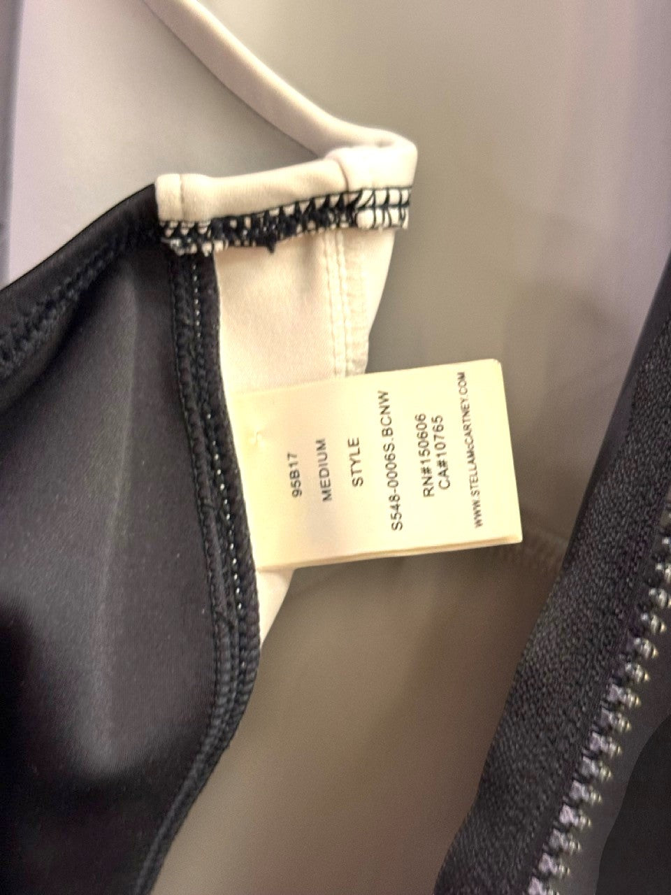 BERLIN VINTAGE CORNER Stella McCartney swimsuit interior label showing size medium and product details