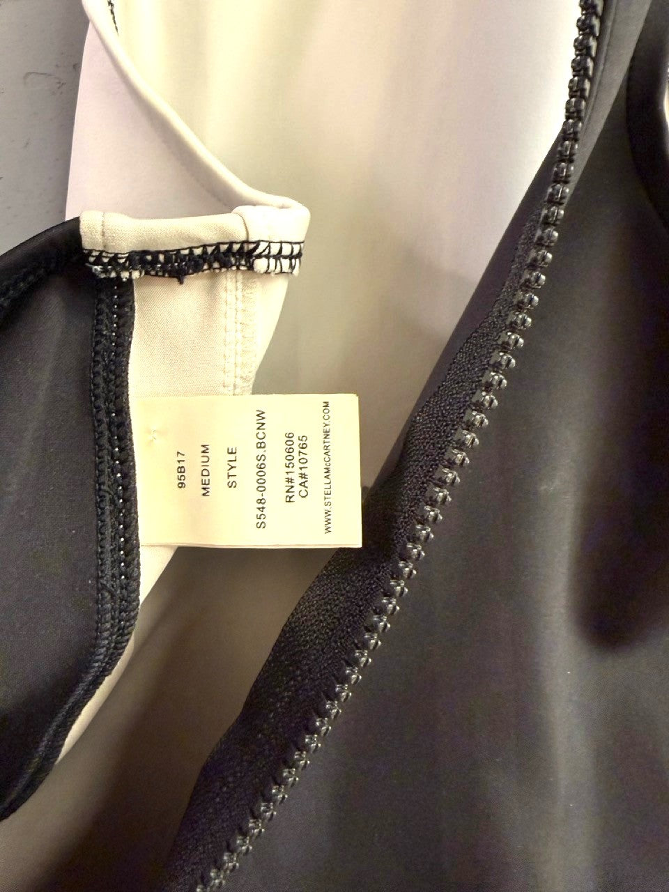 BERLIN VINTAGE CORNER Stella McCartney swimsuit interior label showing size medium and black and white fabric details