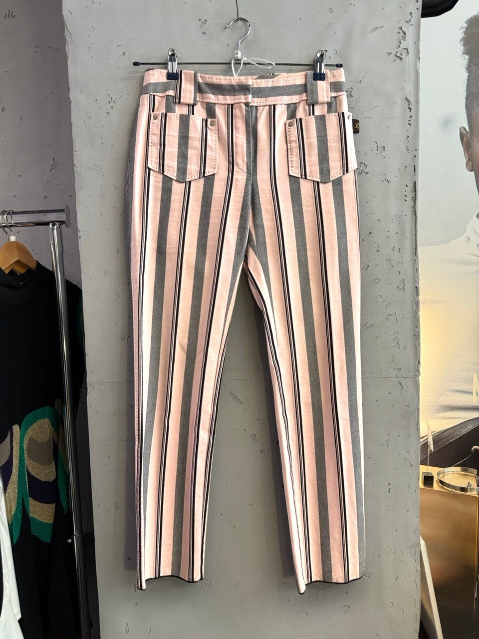 BERLIN VINTAGE CORNER pink, charcoal grey, and black striped cotton pants with a classic waistband and belt loops.