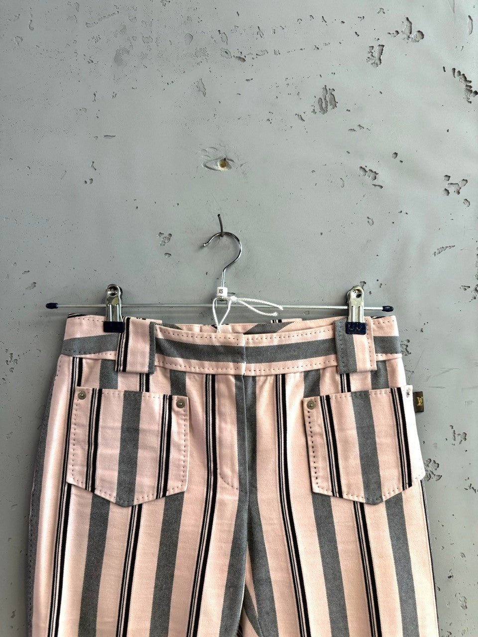 BERLIN VINTAGE CORNER pink, charcoal grey, and black striped cotton pants with pockets and belt loops.