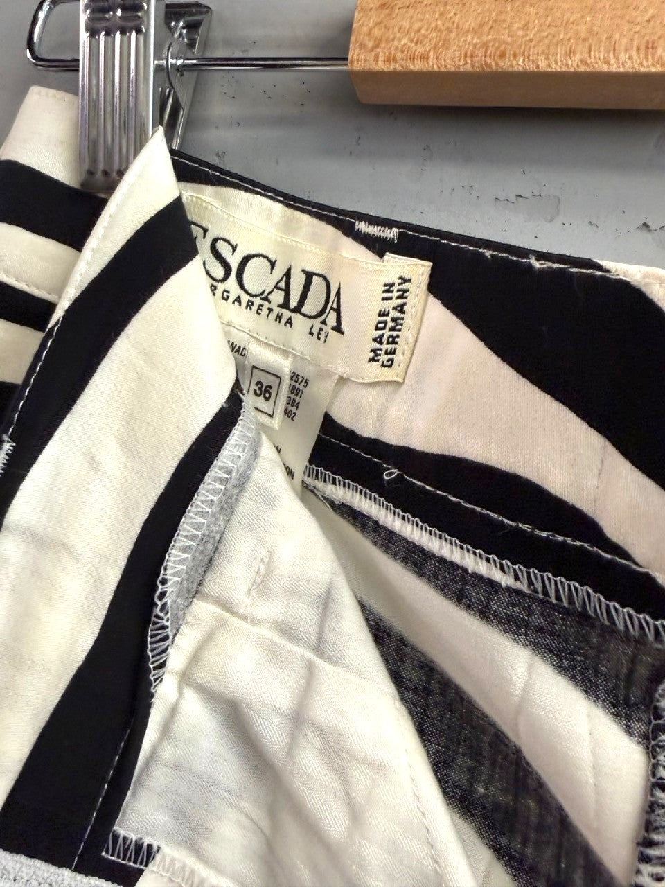 BERLIN VINTAGE CORNER black and white striped high-waisted shorts with pleated front and belt loops.