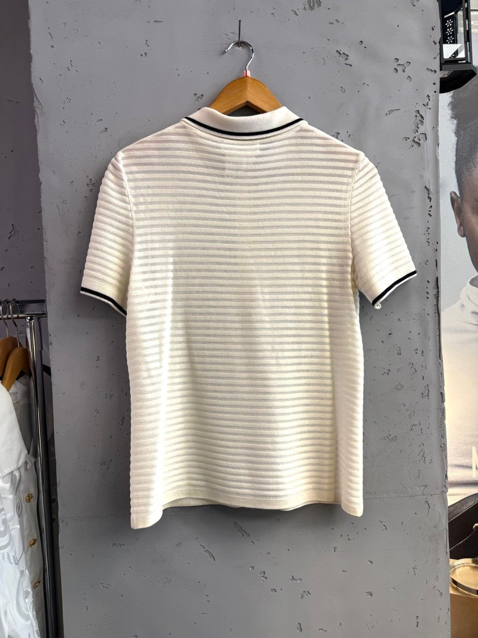 BERLIN VINTAGE CORNER cream knit polo shirt with horizontal stripes, black trim on collar and cuffs.