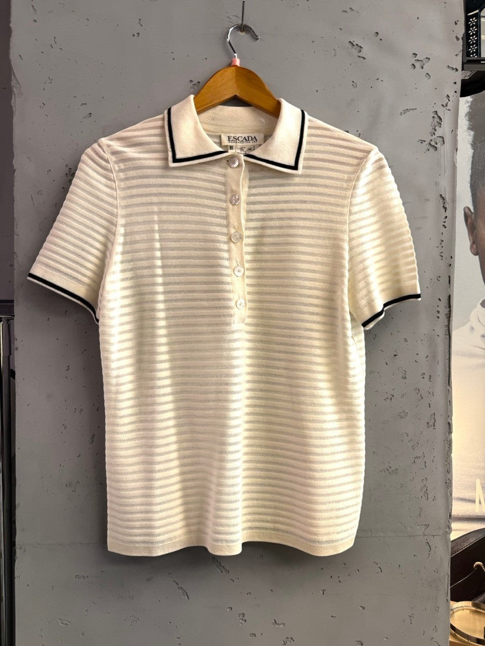 BERLIN VINTAGE CORNER cream knit polo shirt with horizontal stripes, black trim on collar and cuffs.