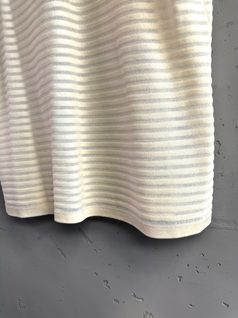 BERLIN VINTAGE CORNER cream knit polo shirt with subtle grey horizontal stripes and black trim.