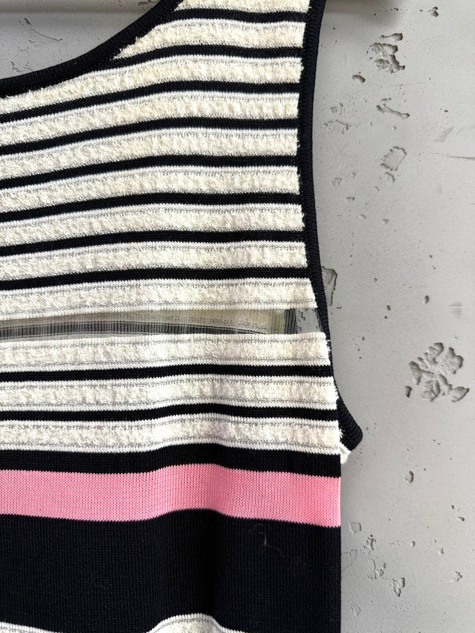 BERLIN VINTAGE CORNER black, white, and pink striped knit tank top with sheer mesh detail across chest.