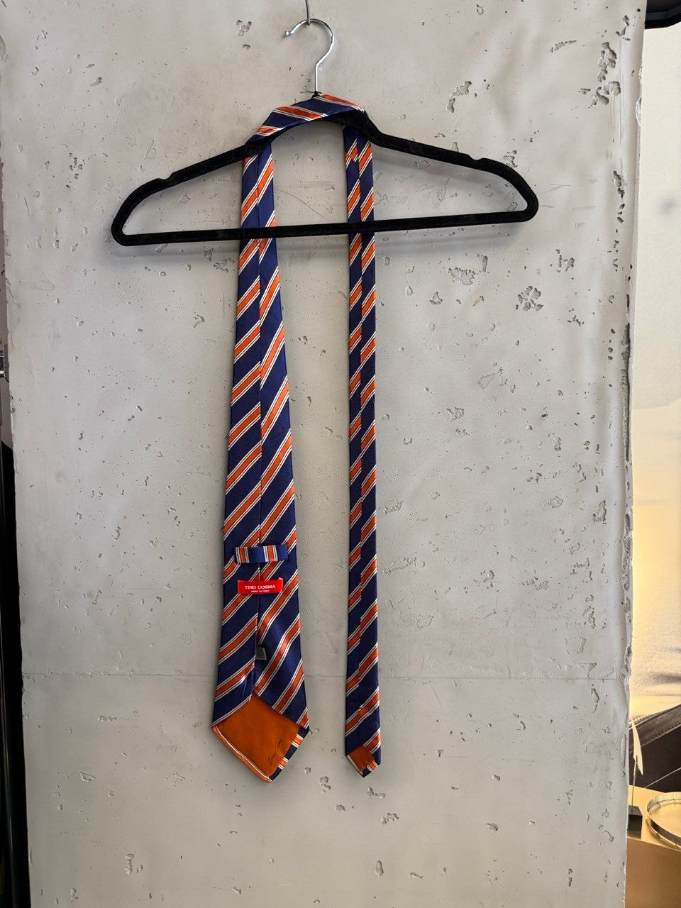 BERLIN VINTAGE CORNER navy blue and coral orange striped necktie accessory for men. Classic diagonal stripe pattern.
