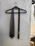 BERLIN VINTAGE CORNER navy, charcoal grey, and white striped silk necktie with subtle sheen.