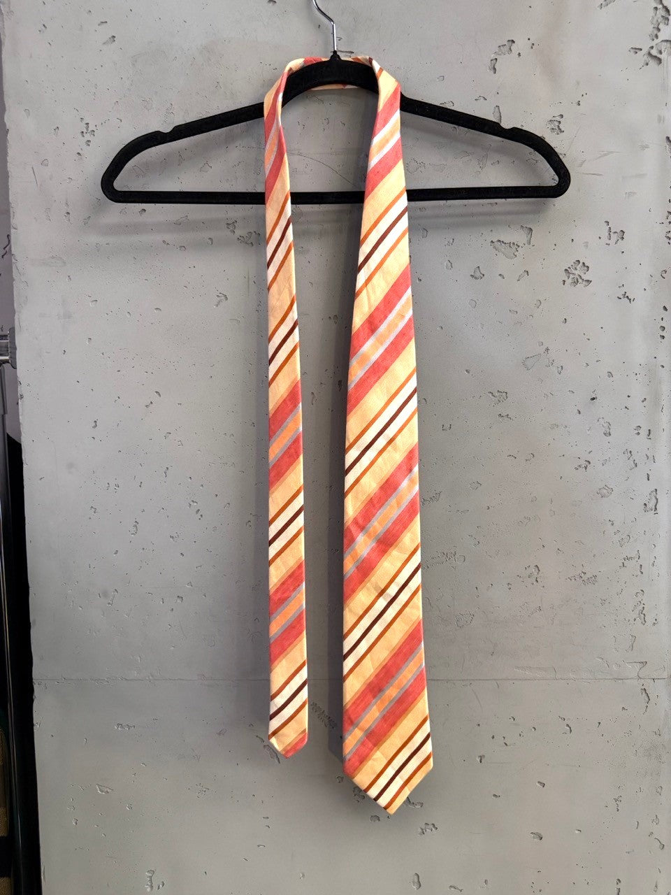 BERLIN VINTAGE CORNER men's silk necktie with diagonal stripes in peach, coral, cream, and brown.