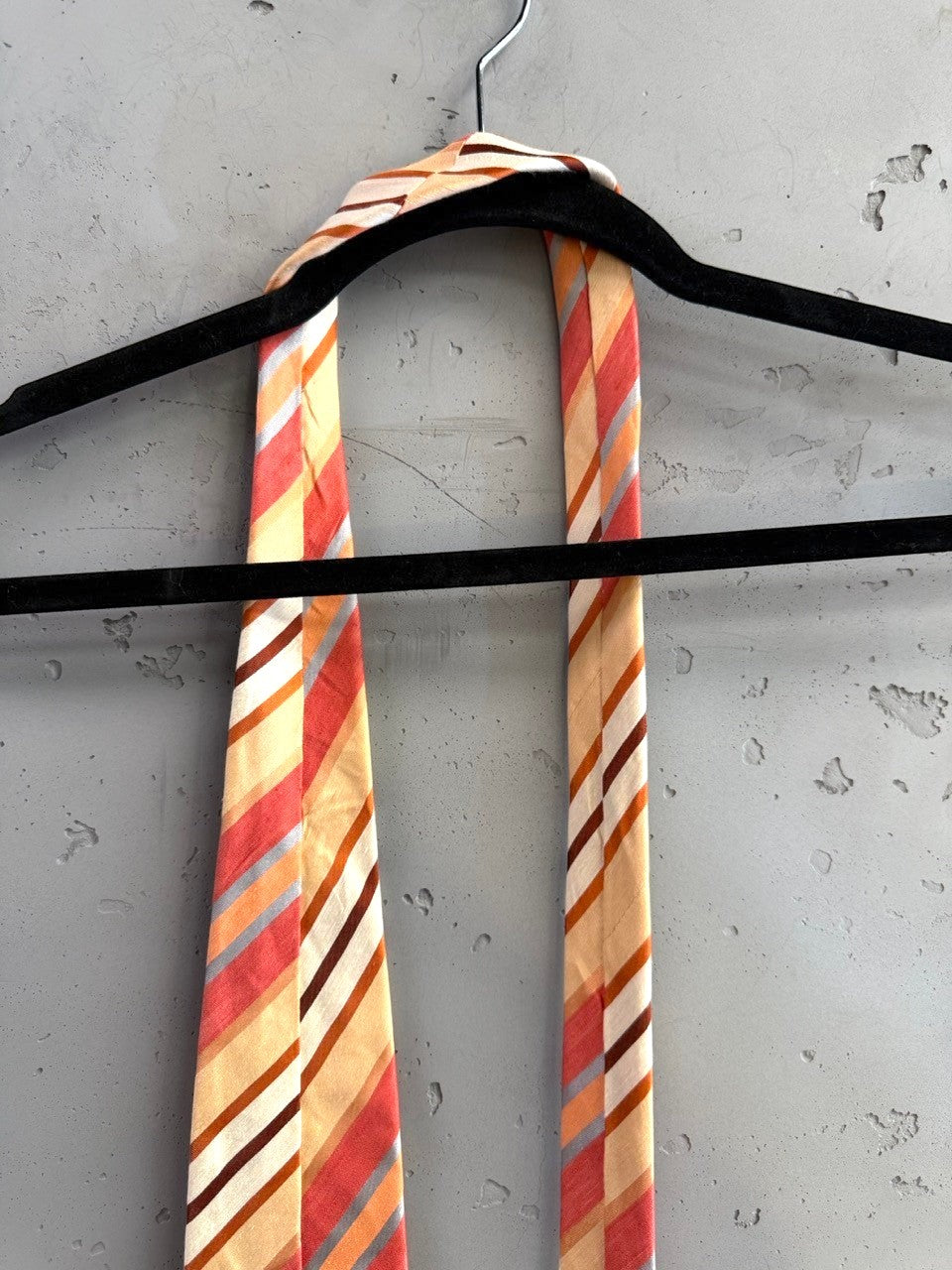 BERLIN VINTAGE CORNER men's silk necktie with diagonal stripes in peach, coral, cream, brown, grey, and blue.