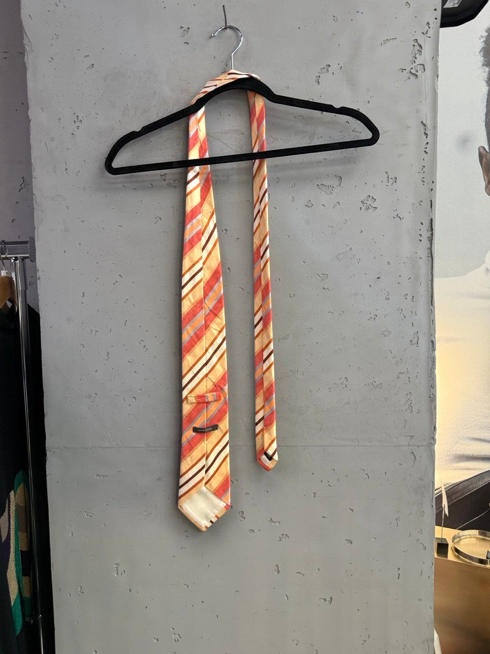 BERLIN VINTAGE CORNER men's silk necktie with diagonal stripes in peach, coral, cream, brown, grey, and blue.
