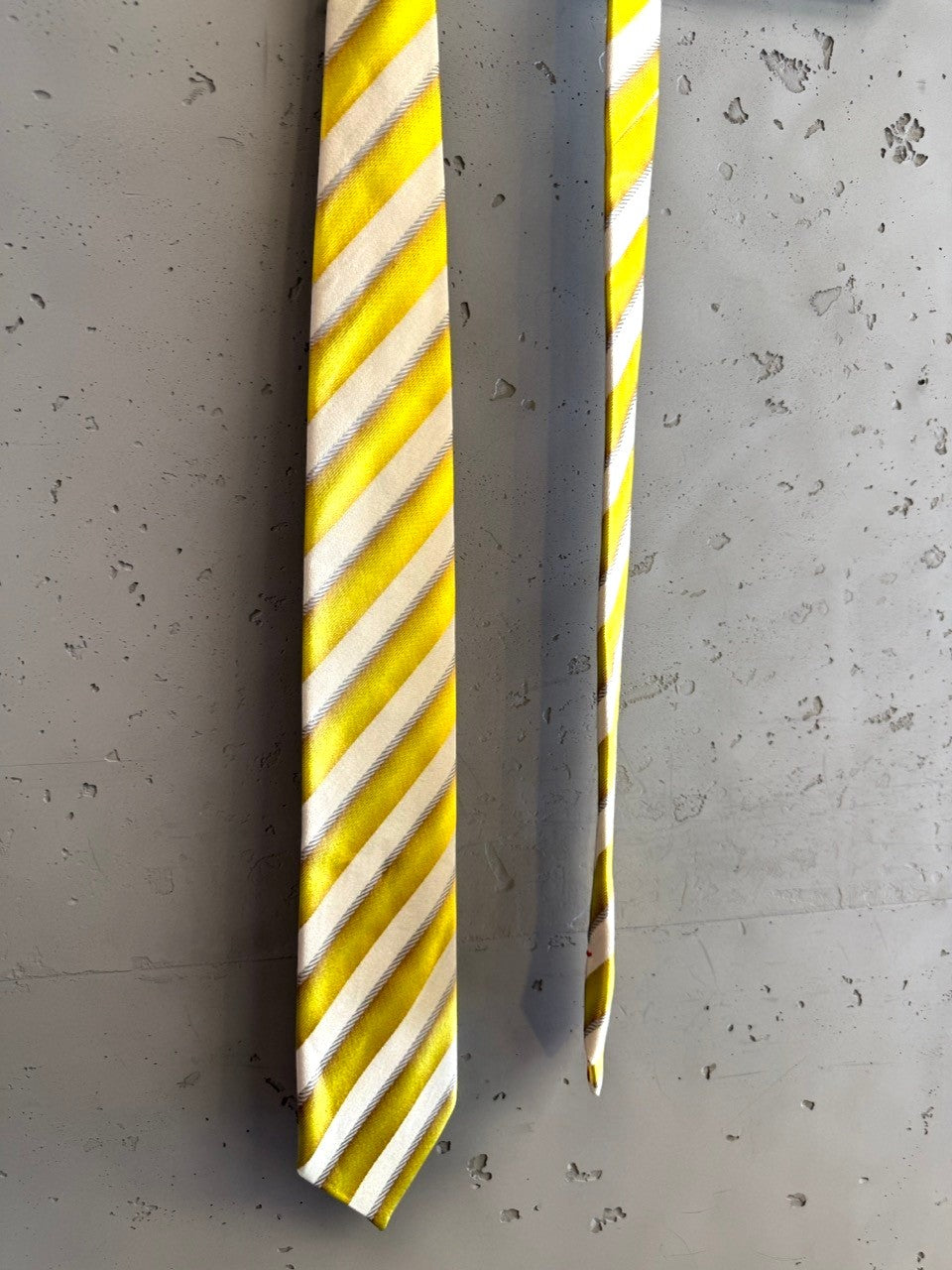 BERLIN VINTAGE CORNER yellow, white, and grey striped silk necktie with a subtle sheen.