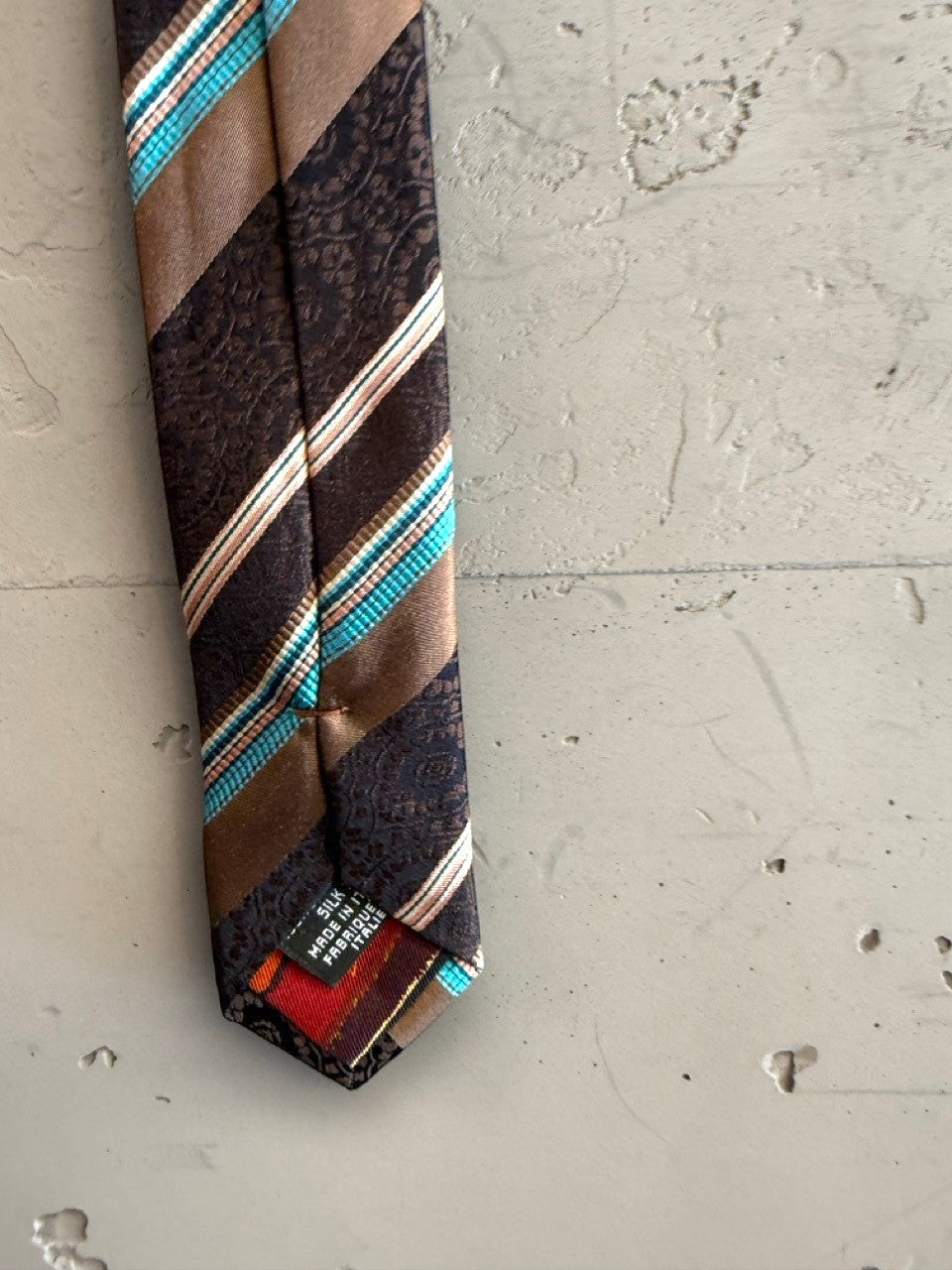 BERLIN VINTAGE CORNER brown silk tie with diagonal stripes of turquoise, white, and tan, featuring a subtle paisley pattern. Made in Italy.