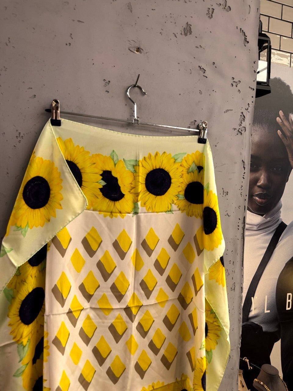 BERLIN VINTAGE CORNER silk scarf with yellow sunflower border and geometric diamond pattern on pale yellow background.