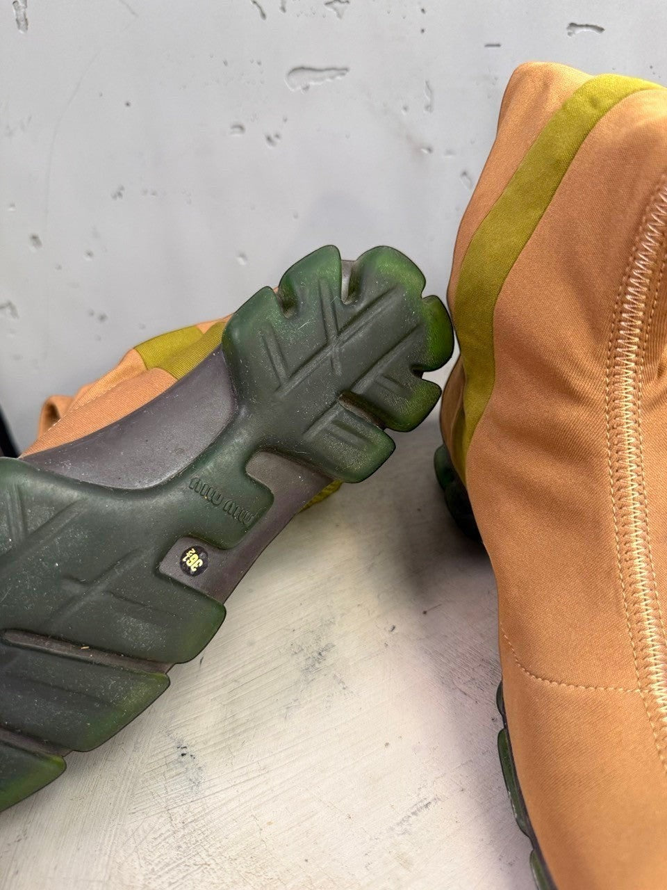 BERLIN VINTAGE CORNER tan fabric mid-calf boots with olive green ribbed knit details and a segmented green outsole.
