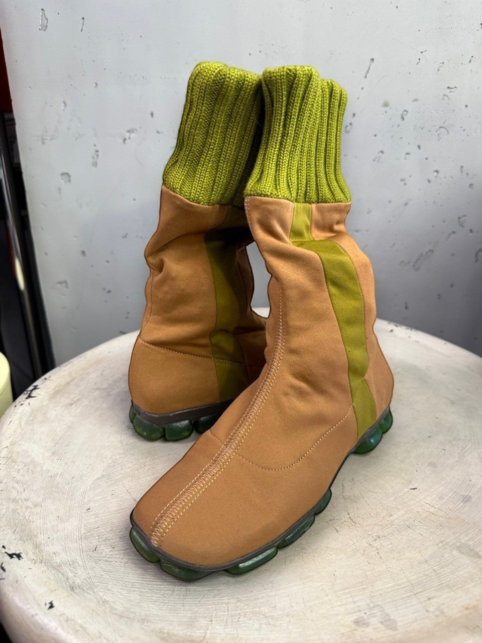BERLIN VINTAGE CORNER mid-calf boots in tan fabric with olive green ribbed knit cuffs and segmented green outsoles.