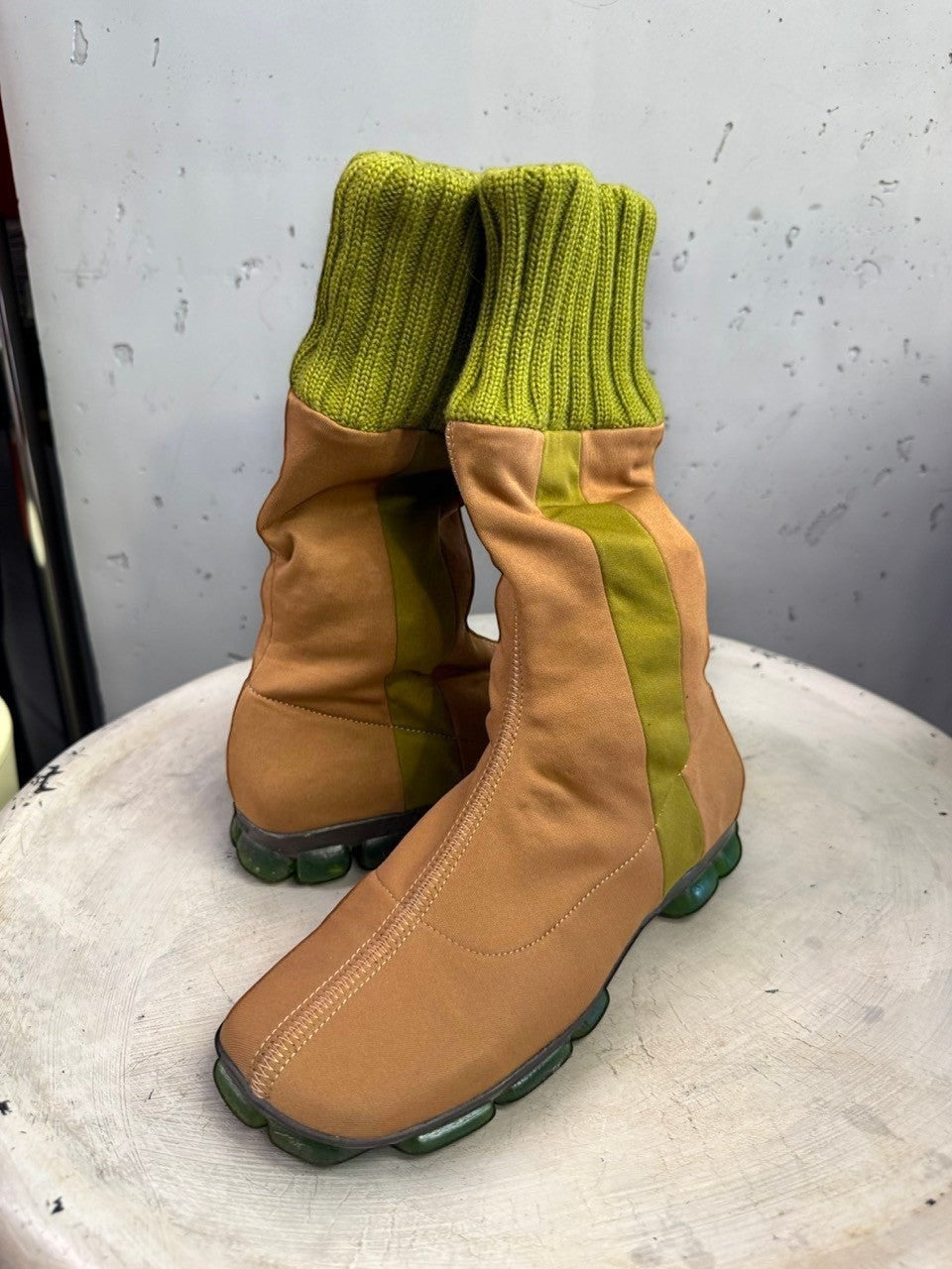 BERLIN VINTAGE CORNER tan fabric mid-calf boots with olive green ribbed knit cuffs and segmented green outsoles.