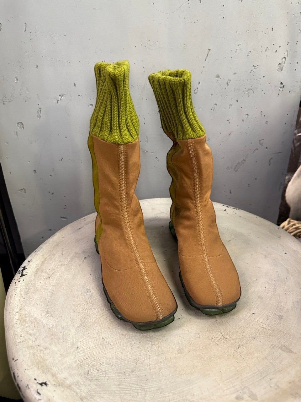 BERLIN VINTAGE CORNER tan fabric mid-calf boots with olive green ribbed knit cuffs and segmented green outsoles.