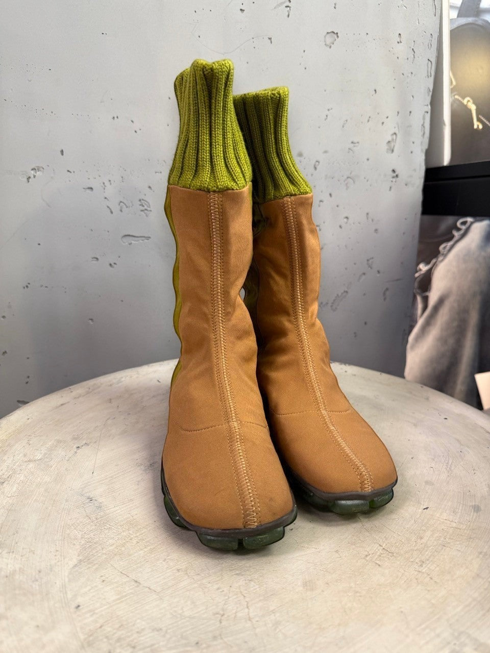 BERLIN VINTAGE CORNER mid-calf boots in tan fabric with olive green ribbed knit cuffs and segmented green outsoles.