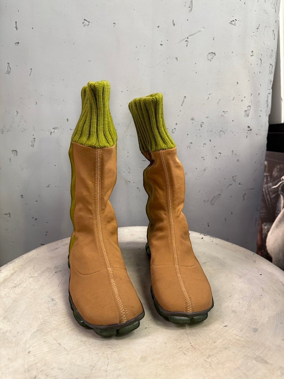 BERLIN VINTAGE CORNER mid-calf boots in tan fabric with olive green ribbed knit cuffs and segmented green outsoles.