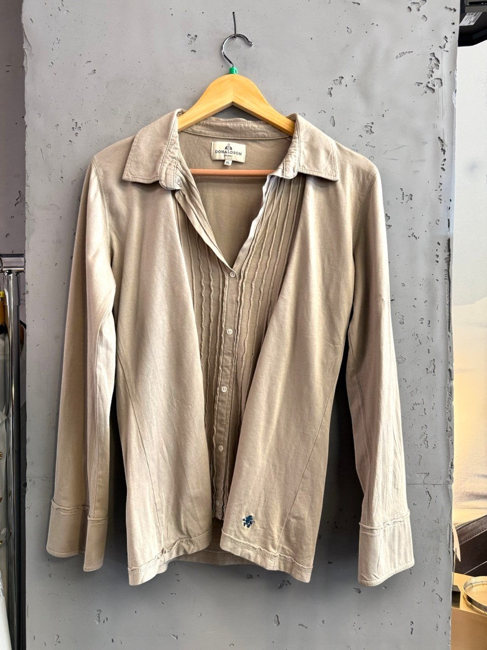 BERLIN VINTAGE CORNER taupe long sleeve button-up shirt with pintuck detail and embroidered logo on hem.