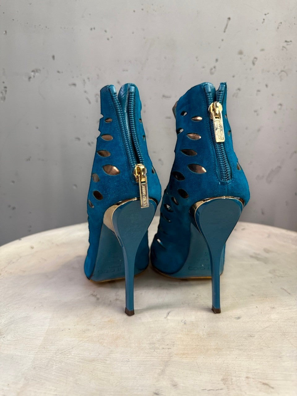 BERLIN VINTAGE CORNER teal blue suede Jimmy Choo peep-toe booties with laser-cut details and gold stiletto heels.