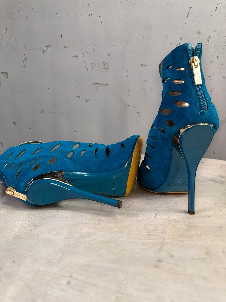 BERLIN VINTAGE CORNER teal suede Jimmy Choo peep-toe booties with laser-cut details and gold stiletto heels.