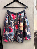 BERLIN VINTAGE CORNER Ted Baker navy floral A-line skirt with a prominent metallic back zipper on a hanger.