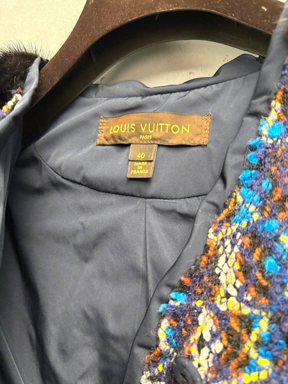 BERLIN VINTAGE CORNER textured tweed cropped jacket with blue, brown, yellow, and black fur accents.