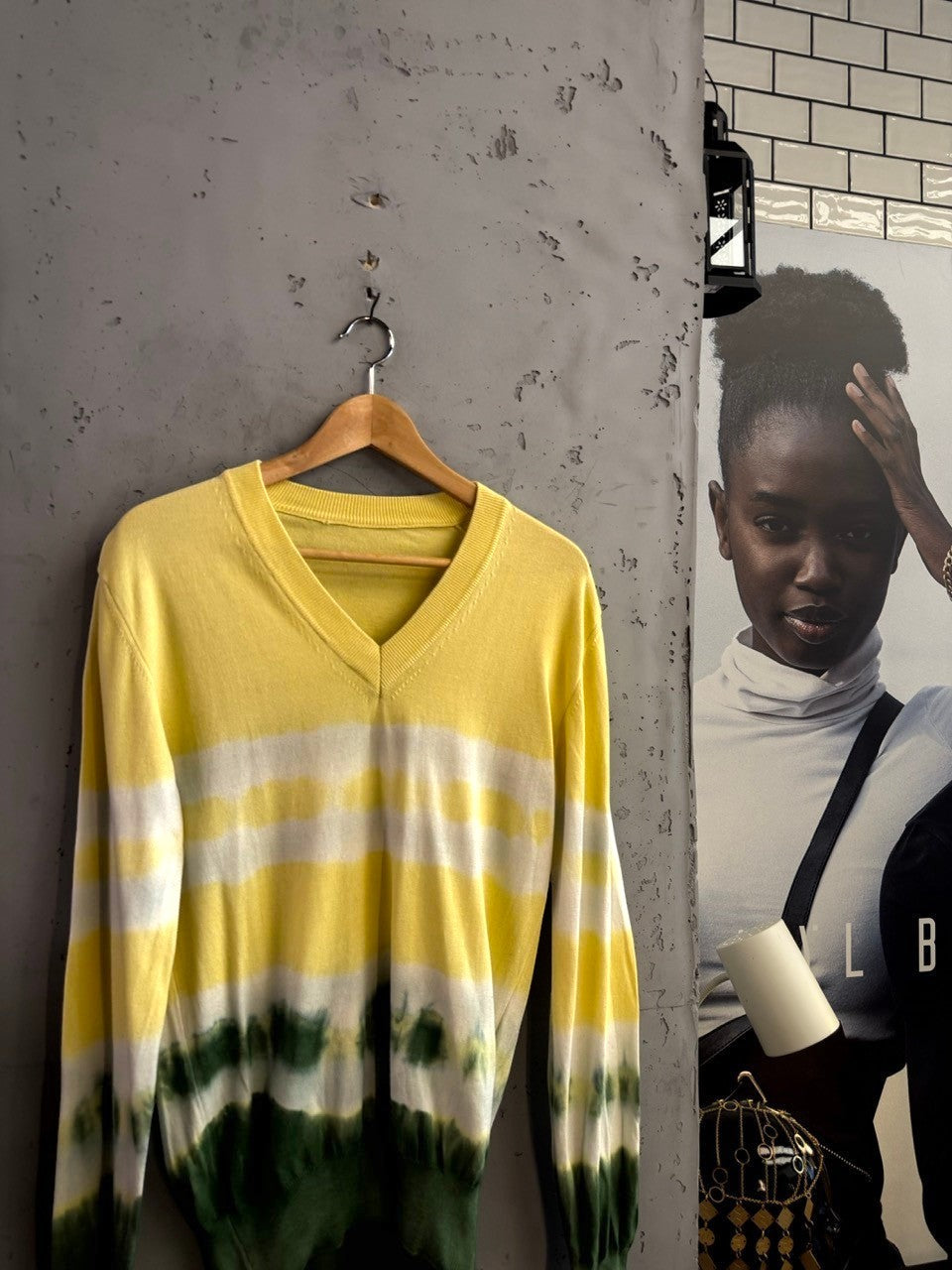 BERLIN VINTAGE CORNER D&G Dolce & Gabbana yellow and green tie-dye V-neck knit sweater on a wooden hanger