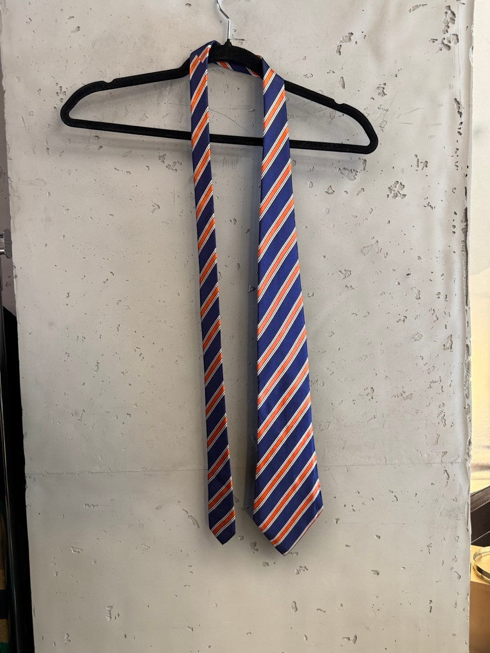 BERLIN VINTAGE CORNER Tino Cosma silk necktie featuring diagonal navy blue, orange, and white stripes.